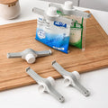 https://ae-pic-a1.aliexpress-media.com/kf/S63da1f54318f468492ec881bde0c3fd2w/Screw-Cap-Sealing-Clip-Seasoning-Bag-Milk-Powder-Salt-Bag-Sealing-Clip-Snack-Food-Preservation-Clip.jpg